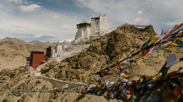 Breathtaking view of the majestic mountains in Leh Ladakh, with a guide on How To Reach Leh Ladakh, insights on the Best Time To Visit Leh Ladakh, and highlights from a memorable Leh Ladakh Tour.